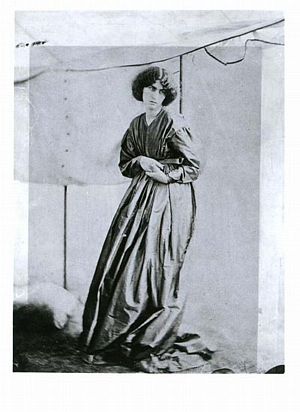 Jane Morris standing, in marquee